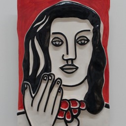 Face By Hand On A Red Background